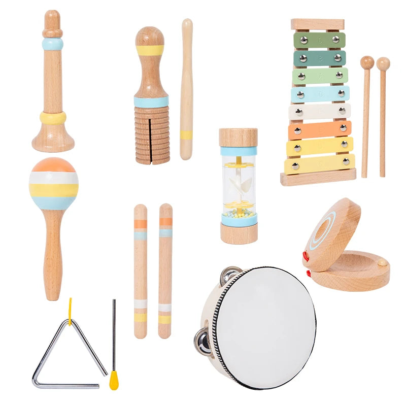A set of wooden percussion instruments including a mallet, drumsticks, and a tambourine.