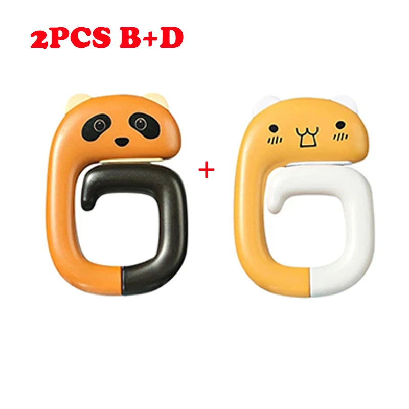 Two pairs of cute animal-themed portable bag hooks, one black and orange panda and one white and yellow cat.