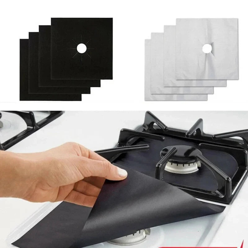 A hand places a black reusable stove burner mat onto a black stovetop.