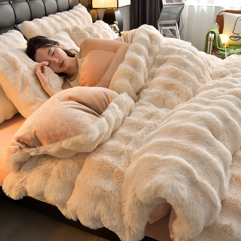A woman relaxing on a fluffy beige faux fur bedding set in a bedroom.