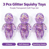 A set of three purple transparent glitter squishy toys made of soft material