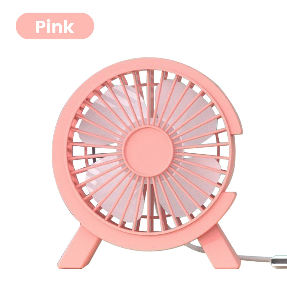 A pink compact USB rechargeable desk fan with a circular grille design.