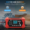 An orange and black 12V intelligent pulse repair charger device with an LCD display is shown against a snowy mountain backgro