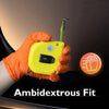 A hand wearing an orange glove is holding a yellow ambidextrous fit device with a green tool attached.