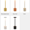 A display of multiple styles and colors for a touch control rechargeable LED table lamp including gold, rose gold, silver, wh