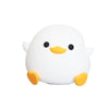 A white, round duck-shaped night light with yellow feet and black eyes.
