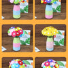 A set of colorful felt and button flowers arranged in glass vases for a DIY bouquet making craft kit.