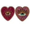 Two heart-shaped patches decorated with sparkling beads and rhinestones, featuring sunburst and eye motifs.