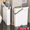 A white hands-free mop and bucket set with a self-cleaning wringer is shown standing next to a gold-toned surface.