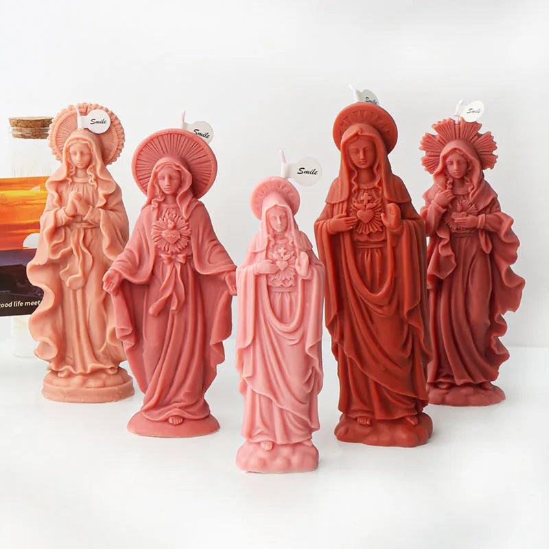 A set of five terracotta-colored 3D silicone molds depicting figures of the Virgin Mary with halos.