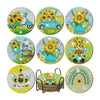 A set of eight ocean-themed diamond art coasters and a holder featuring yellow, blue, and green designs.