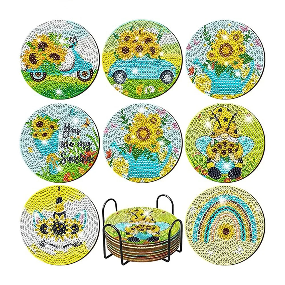 A set of eight ocean-themed diamond art coasters and a holder featuring yellow, blue, and green designs.