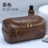 A brown PU vintage luxury toiletry bag with gold zippers and a small bottle is shown on a white surface.