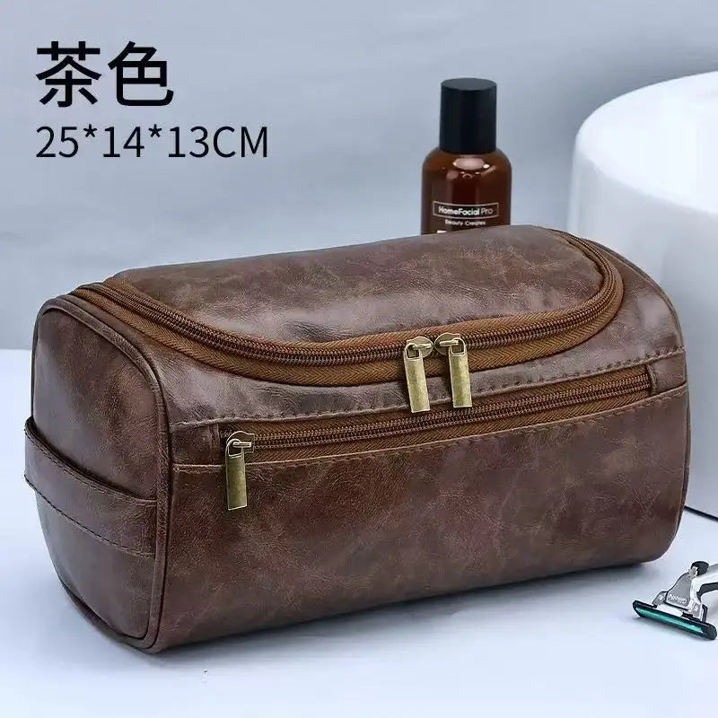 A brown PU vintage luxury toiletry bag with gold zippers and a small bottle is shown on a white surface.