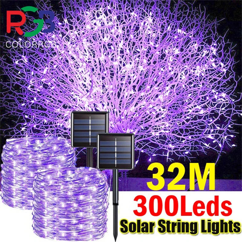 A bundle of purple LED string lights illuminates a dense, glowing bush against a dark background.