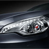 Close-up of a silver car's headlight featuring a 3-inch dynamic devil eye LED light.