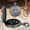 A detailed image of a dragon-themed metal dice case and watch, featuring a 7-sided polyhedral die.