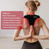 A woman is wearing a black red light therapy belt on her upper back while performing a prayer gesture.