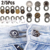 A collection of 2 to 5 metal extender buttons in various sizes and finishes for clothing