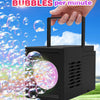 A hand holds a black handheld bubble machine that is actively blowing many bubbles into the air.