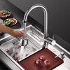 A modern stainless steel kitchen faucet is shown dispensing water into a sink, with fresh ingredients nearby.