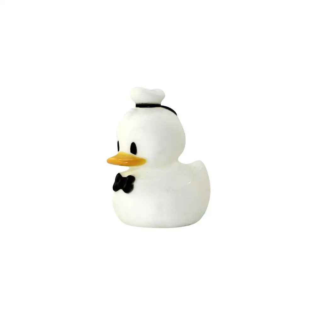 A white rubber duck bath toy with a black top and beak.