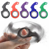 A set of six metal fidget spinner keychains in various colors, including black, red, purple, blue, and green, being held by a