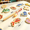A collection of wooden magnetic fishing toys featuring various marine animals like fish and sea creatures.