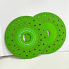 A green diamond cutting and grinding blade with a perforated edge is shown on a white background.