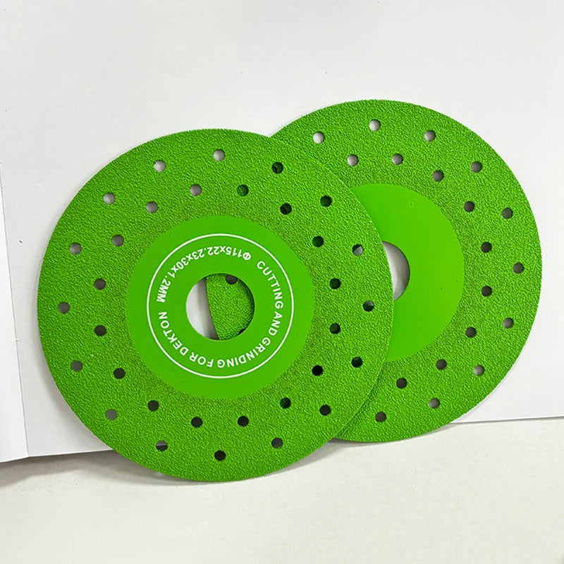A green diamond cutting and grinding blade with a perforated edge is shown on a white background.