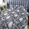 A black and white tiger print duvet cover set with matching pillowcases displayed on a bed.