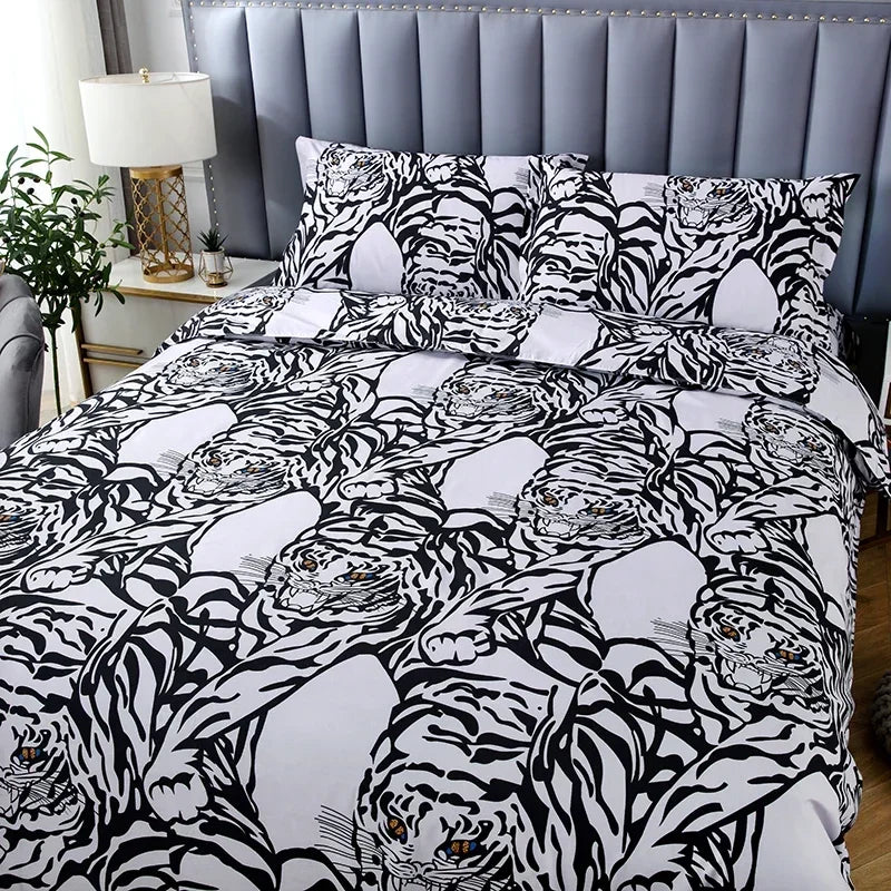 A black and white tiger print duvet cover set with matching pillowcases displayed on a bed.