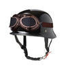 A black half helmet with integrated brown goggles and a black strap for motorcycle or scooter riders.