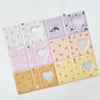 A set of clear photo album pages with heart cutouts featuring various pastel colors and cute animal designs.