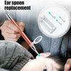 A hand is using a tool to perform an ear spoon replacement procedure on a child's ear.