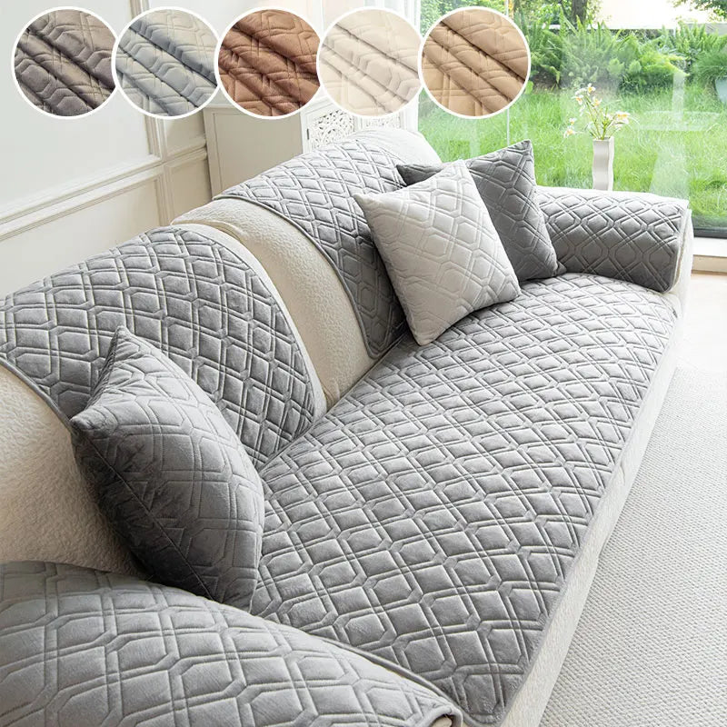 Gray anti-slip sofa cover featuring a quilted geometric pattern with decorative fabric swatches.