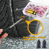 A hand uses a tool to repair a puncture in a rubber tire, with a plastic kit containing repair tools nearby.
