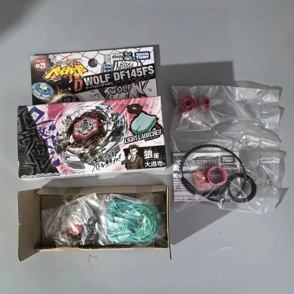 A set of metal spinning tops including a Wolf DF145FS and a Light Launcher in packaging.