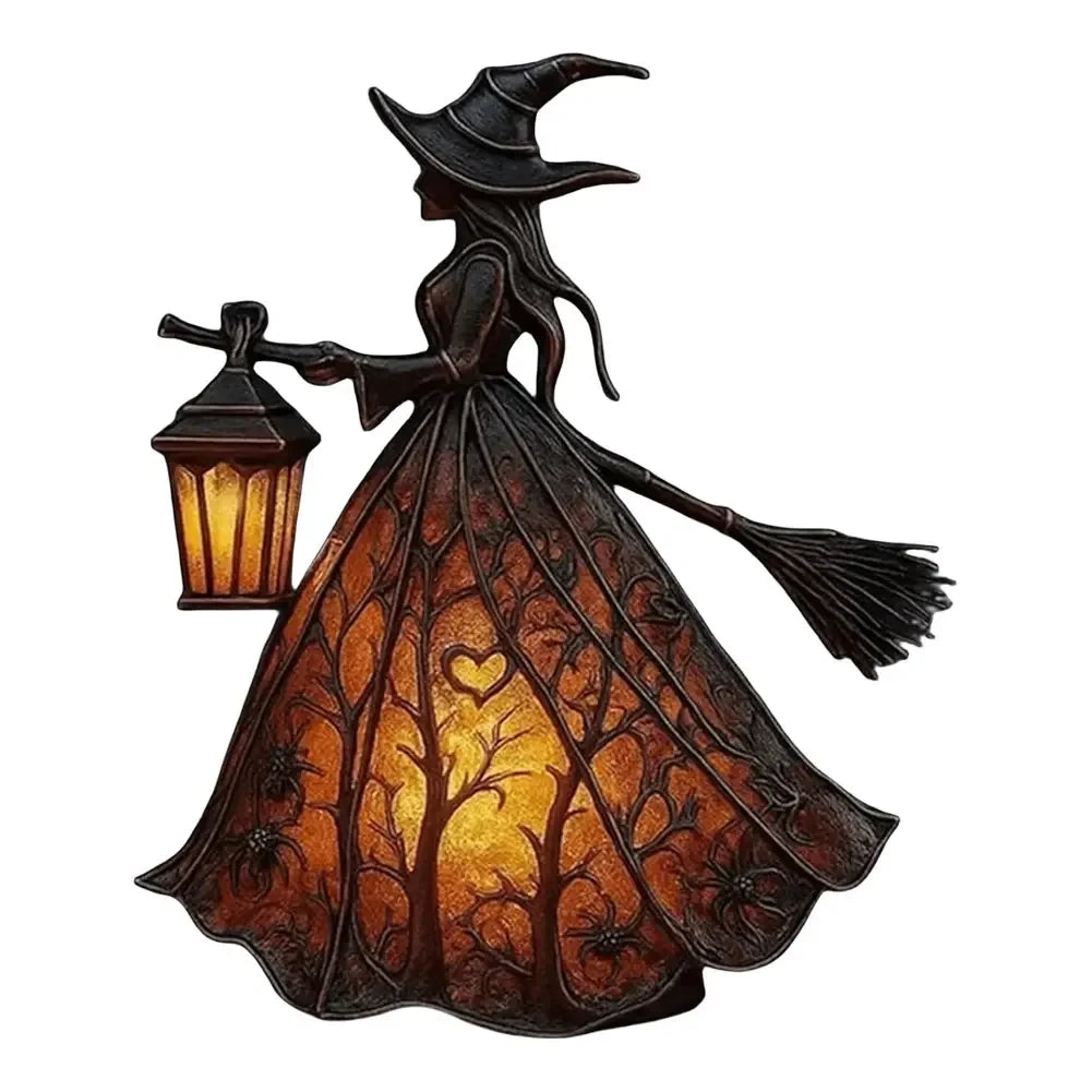 A dark witch figure holding an illuminated lantern, designed as a gothic Halloween decor item.