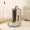 A tall boot storage bag with a transparent window is shown on a light rug.
