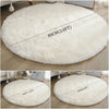 A collection of round, ultra-soft white shaggy rugs shown in different sizes.
