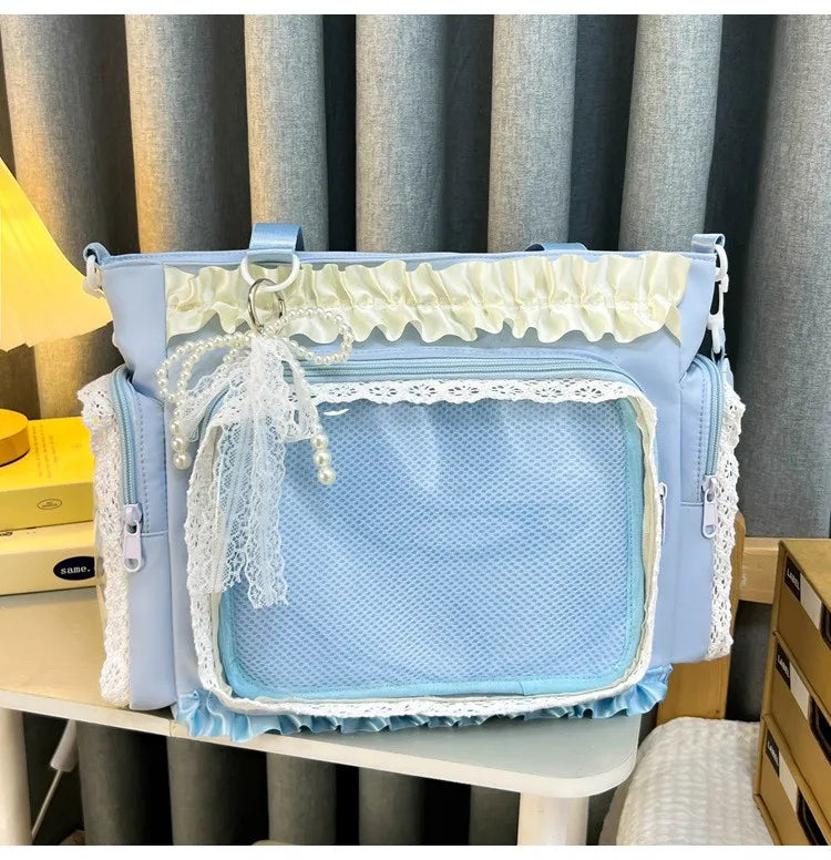 Light blue transparent shoulder bag with white lace trim and ruffled fabric detail