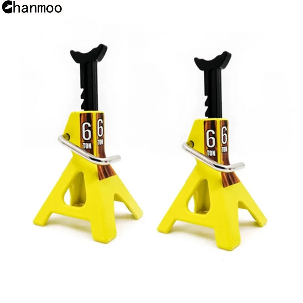 A pair of yellow 6-ton RC car jack stands with black handles and metal lifting arms.