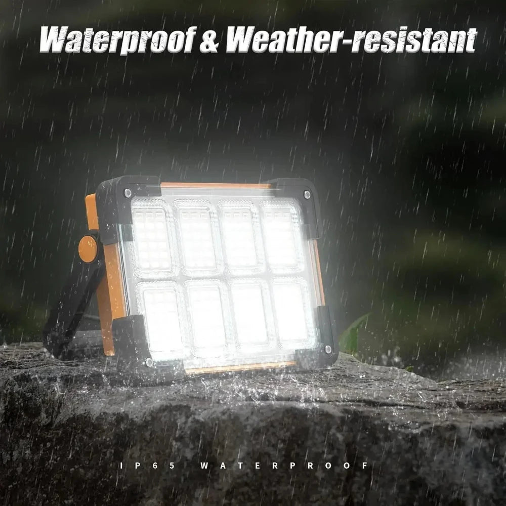A waterproof and weather-resistant LED floodlight is shown shining light on a rock surface in the rain.
