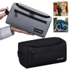 A gray and black travel toiletry bag shown being held, with a similar black version displayed below.