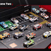 A collection of 48 diecast metal cars displayed on a black track surface.