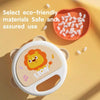 An animal-shaped clapping tambourine for toddlers is shown next to a bowl of small white items on a yellow background.