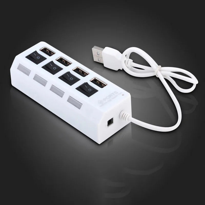 A white USB 2.0 multi-port hub with an LED switch and a white cable is shown on a dark surface.