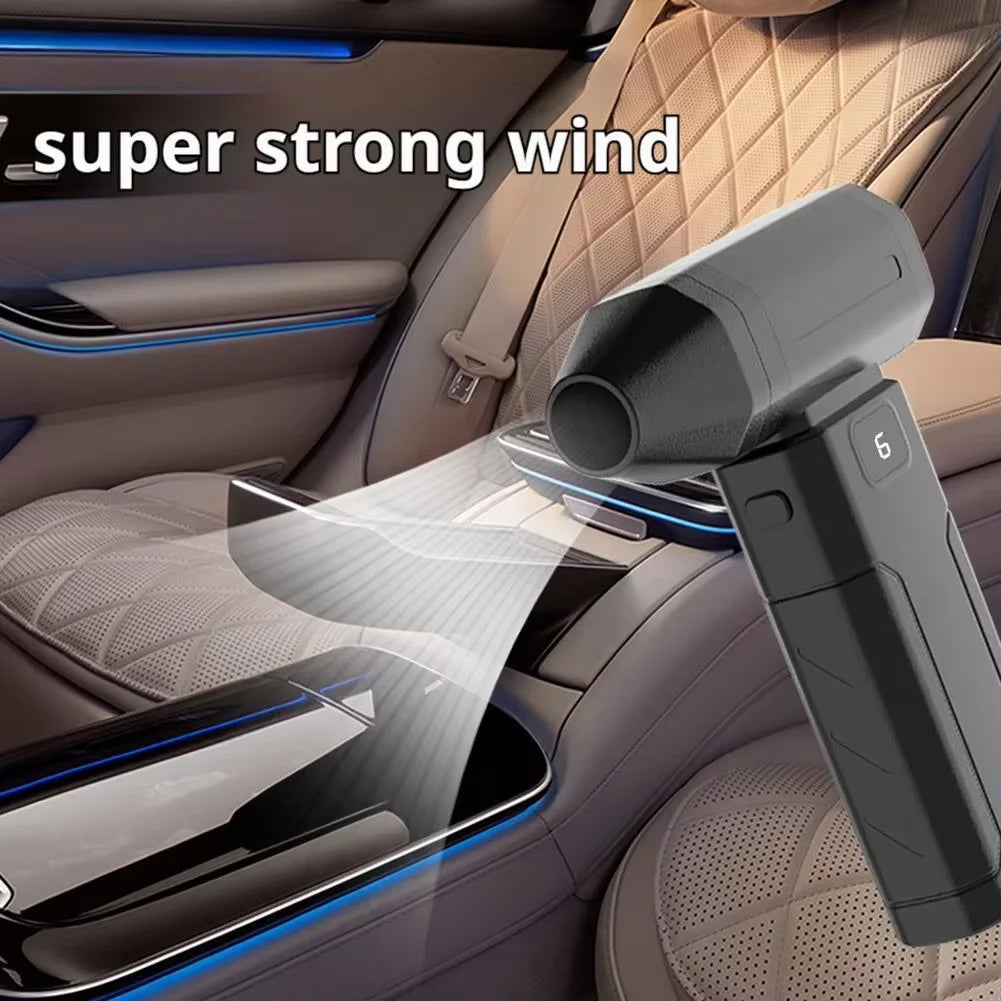 A close-up of a handheld air blower device being used to clean the interior of a car cabin.
