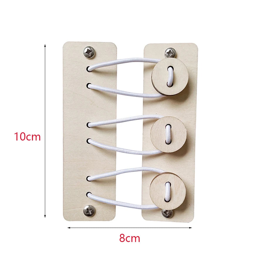 A wooden Montessori busy board with four circular holes for stringing white cord parts.